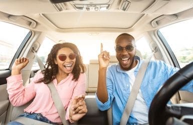 couple in car very happy