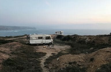 two campers on the coast